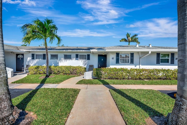 ranch-style house with a front lawn