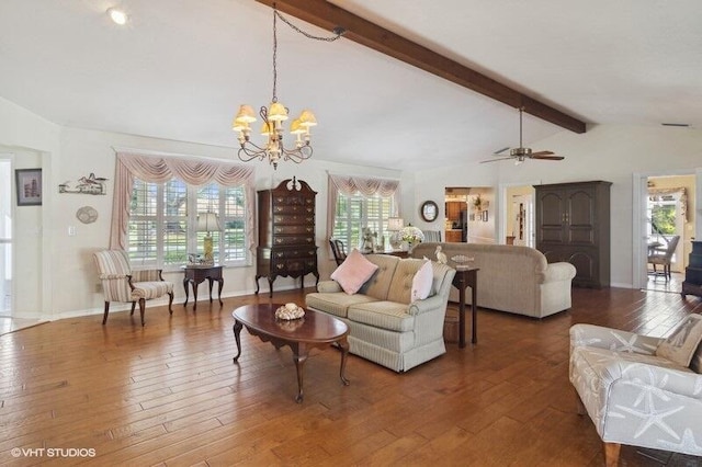 living room featuring ceiling fan with notable chandelier, dark hardwood / wood-style flooring, vaulted ceiling with beams, and a wealth of natural light