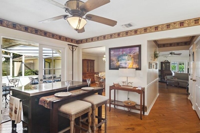 dining room with wood-type flooring and ceiling fan