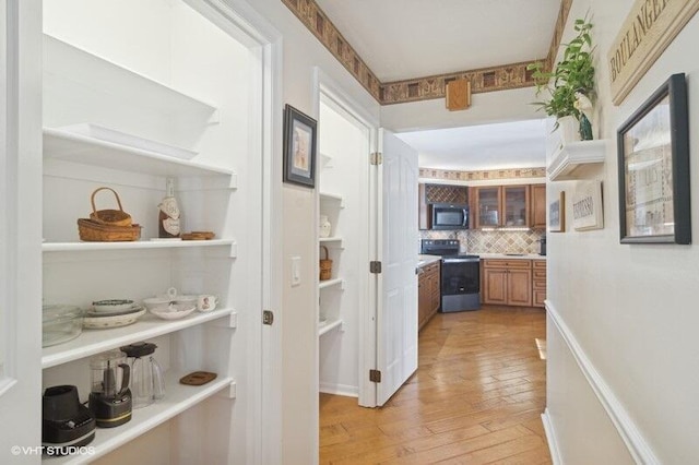 hallway featuring light hardwood / wood-style flooring