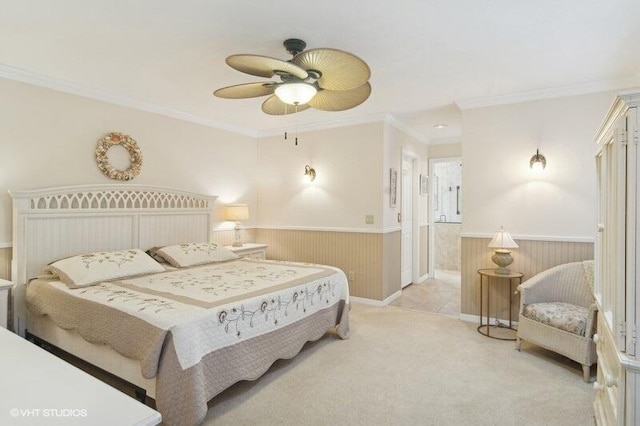 carpeted bedroom with ceiling fan and crown molding