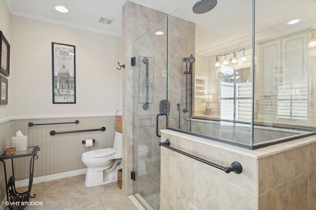 bathroom featuring walk in shower, crown molding, tile patterned flooring, and toilet