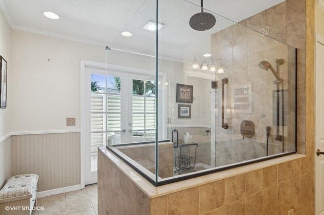 interior space featuring tile patterned floors, a tile shower, and crown molding