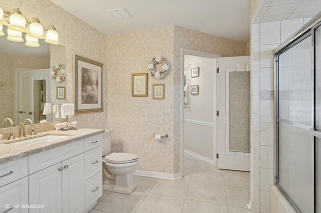 full bathroom with tile patterned floors, shower / bath combination with glass door, vanity, and toilet