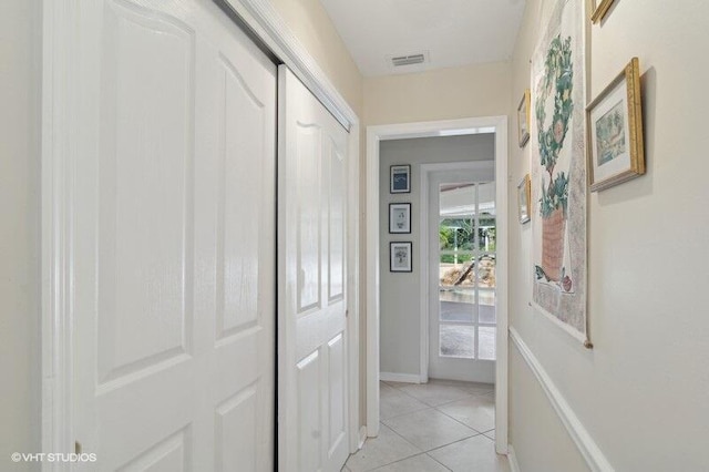 hallway with light tile patterned floors