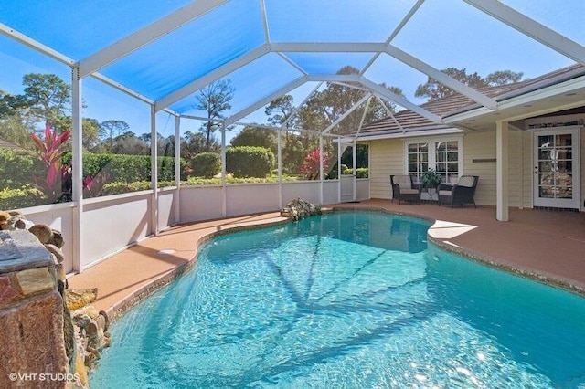 view of pool featuring a lanai and a patio