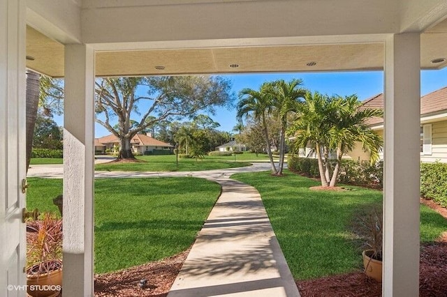 view of property's community featuring a lawn