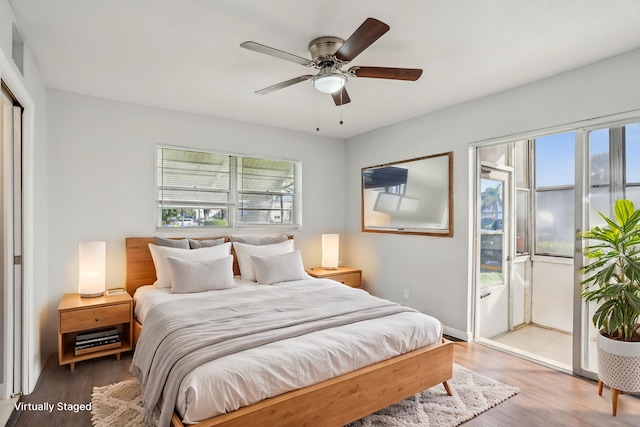 bedroom with hardwood / wood-style floors and ceiling fan