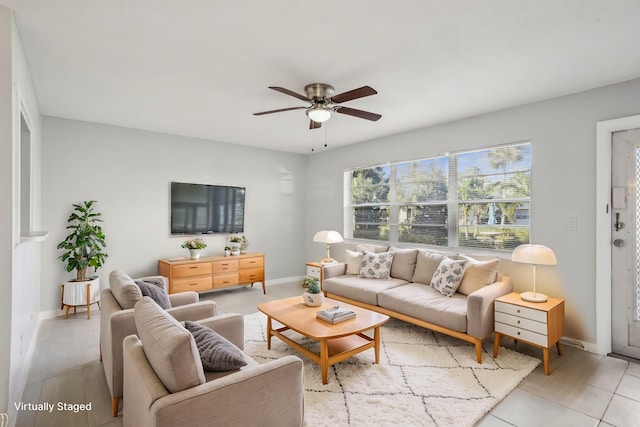 living room featuring ceiling fan and light tile patterned flooring