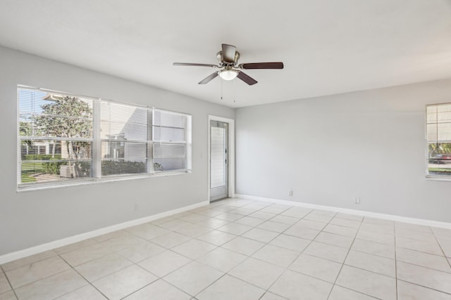 unfurnished room featuring ceiling fan and light tile patterned floors