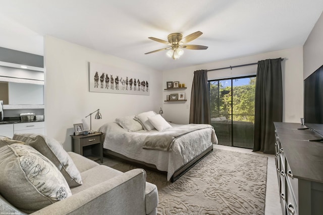 bedroom with access to outside and ceiling fan