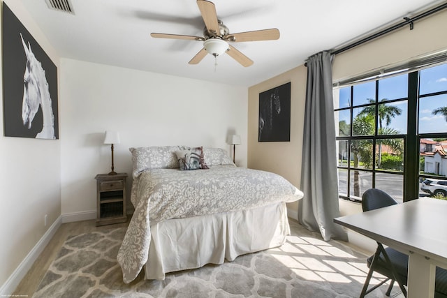 bedroom featuring ceiling fan and light hardwood / wood-style floors