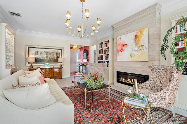 living room featuring a notable chandelier, ornamental molding, and light hardwood / wood-style flooring