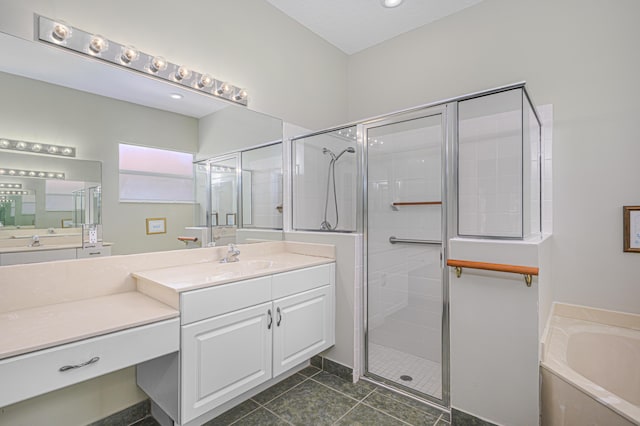 bathroom featuring tile patterned floors, plus walk in shower, and vanity