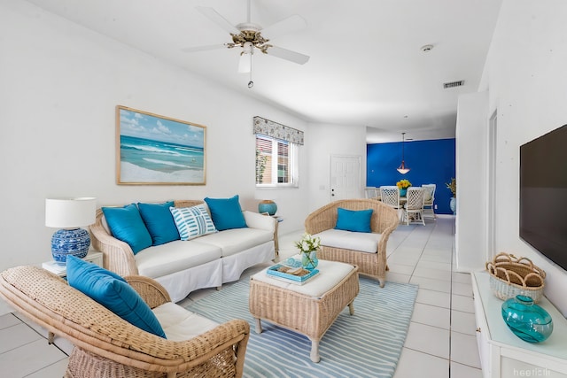 living area with ceiling fan, light tile patterned flooring, and visible vents