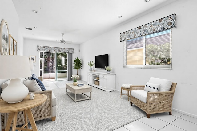 living room featuring light tile patterned floors, baseboards, visible vents, ceiling fan, and recessed lighting