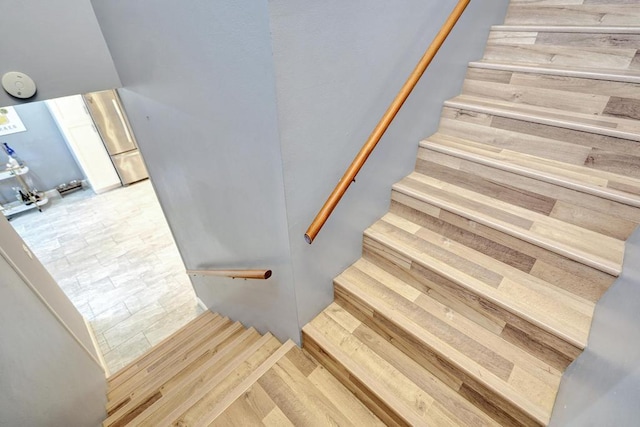 stairs with hardwood / wood-style flooring