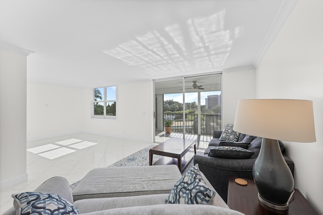 tiled living room with ceiling fan and crown molding