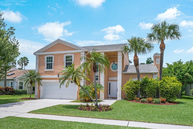 view of front of house featuring a front lawn and a garage