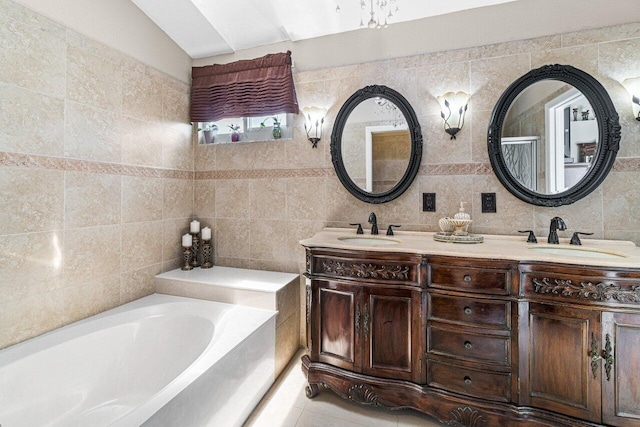 bathroom featuring vanity, vaulted ceiling, tile patterned flooring, tile walls, and tasteful backsplash