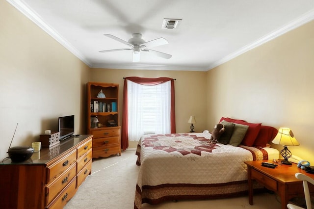 bedroom featuring ceiling fan, crown molding, and light colored carpet