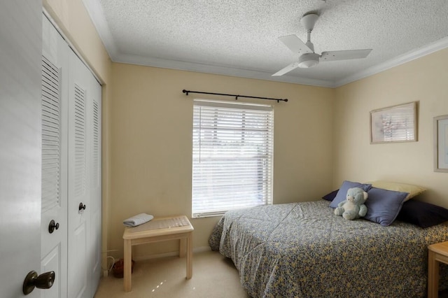 carpeted bedroom with multiple windows, a closet, ceiling fan, and crown molding