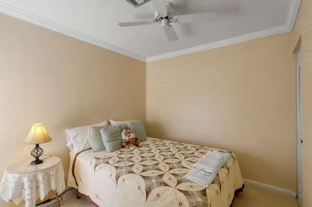 carpeted bedroom with ceiling fan and crown molding