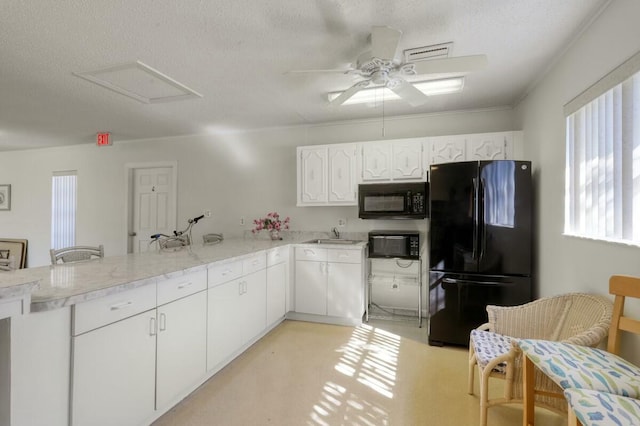 kitchen featuring black appliances, ceiling fan, a textured ceiling, white cabinetry, and kitchen peninsula