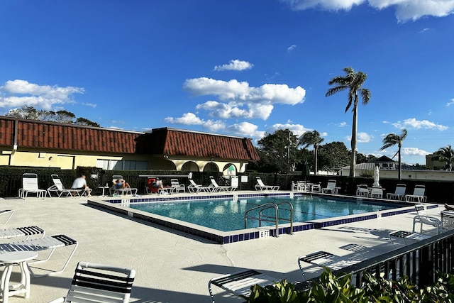 view of swimming pool with a patio