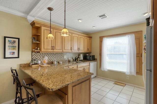 kitchen with a breakfast bar, white dishwasher, hanging light fixtures, light stone countertops, and kitchen peninsula