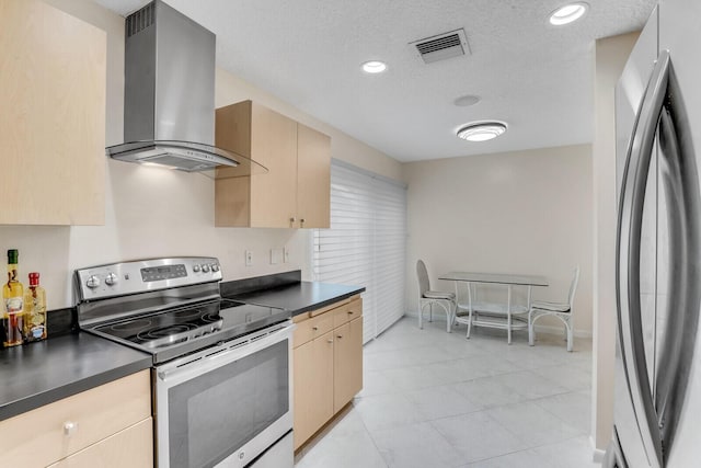 kitchen with stainless steel appliances, dark countertops, visible vents, and island exhaust hood