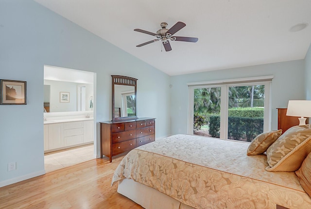 bedroom with lofted ceiling, light wood-style floors, ensuite bath, and ceiling fan