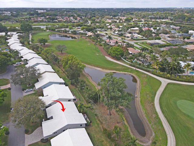 aerial view with a residential view, a water view, and golf course view