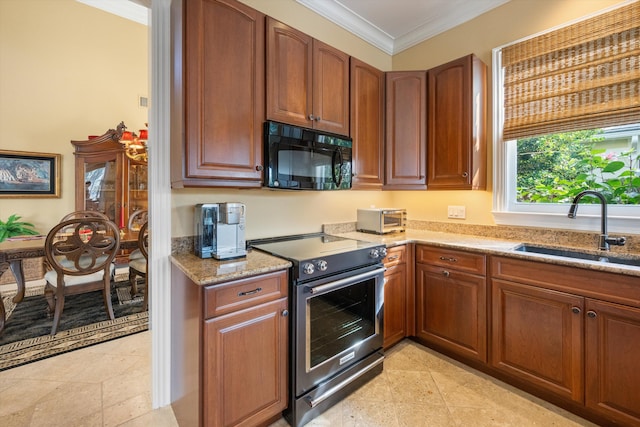 kitchen with light stone countertops, electric range, ornamental molding, and sink