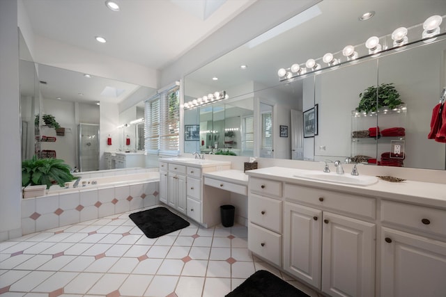 bathroom featuring tile patterned floors, vanity, and separate shower and tub