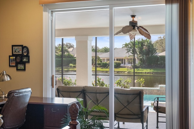 office with ceiling fan and a water view