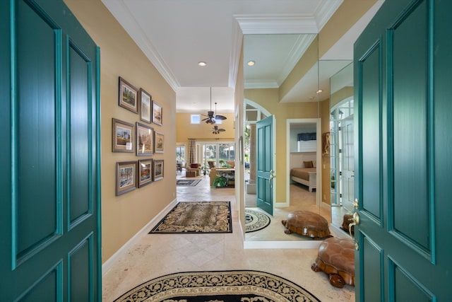 tiled entryway featuring french doors, ceiling fan, and ornamental molding