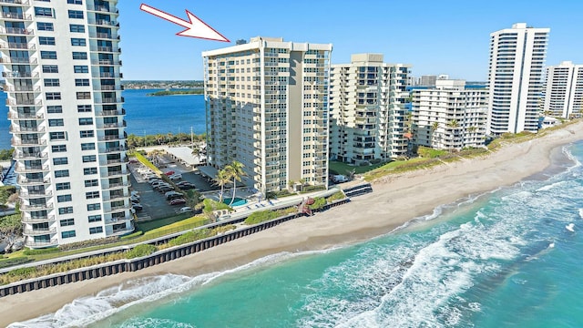 bird's eye view with a view of the beach and a water view