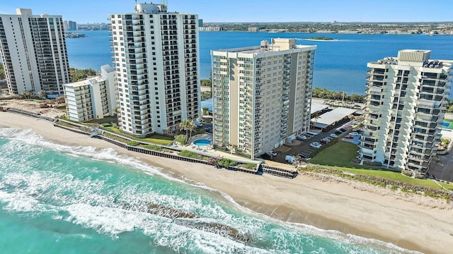 drone / aerial view featuring a view of the beach and a water view