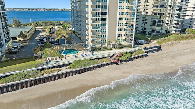 bird's eye view with a view of the beach and a water view