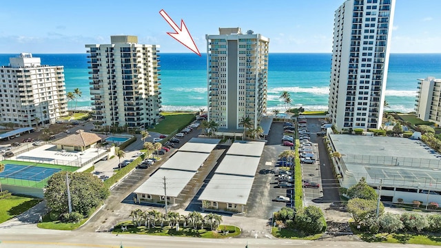 birds eye view of property with a water view