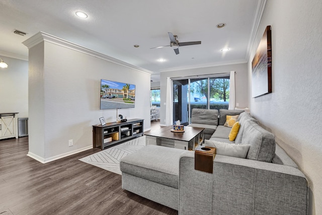 living room featuring ceiling fan, dark hardwood / wood-style flooring, and ornamental molding