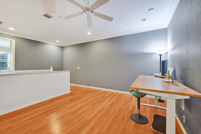 office space with ceiling fan, light wood-type flooring, and crown molding