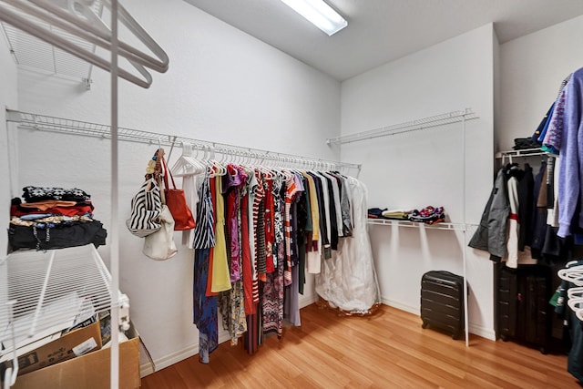 walk in closet featuring hardwood / wood-style flooring