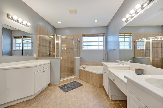 bathroom with tile patterned floors, vanity, and independent shower and bath