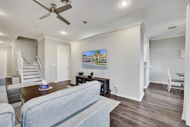 living room with ceiling fan, dark hardwood / wood-style floors, and ornamental molding