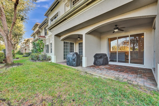 view of yard featuring ceiling fan