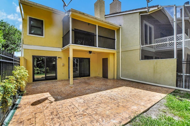 back of house featuring a patio area and ceiling fan