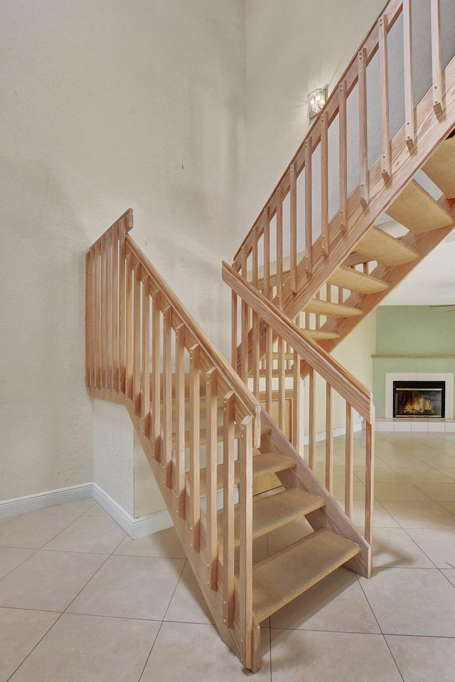 stairway featuring tile patterned flooring