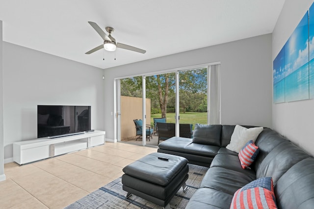 tiled living room featuring ceiling fan